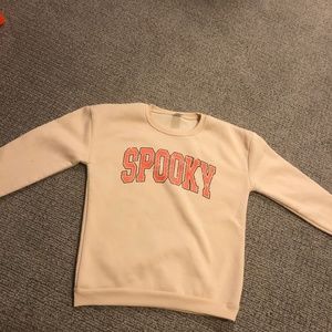 spooky light yellow sweatshirt
